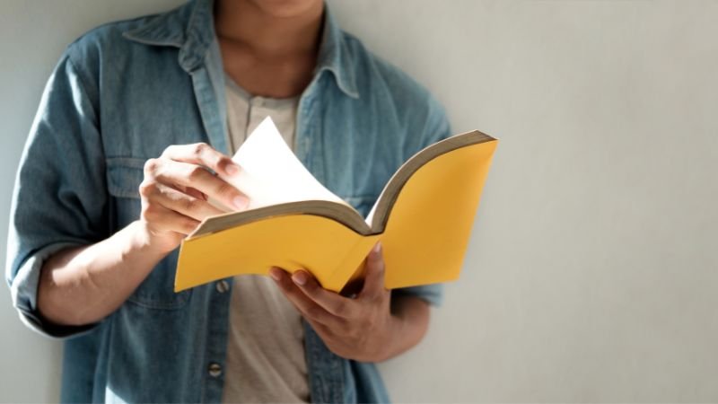 learnings A person flipping through a book.